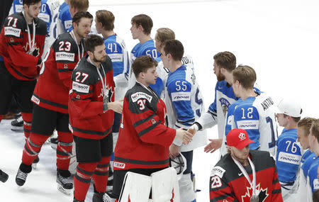Ice Hockey World Championships - Final - Canada v Finland - Ondrej Nepela Arena, Bratislava, Slovakia - May 26, 2019 Canada's players greet Finland's players after the match. REUTERS/Vasily Fedosenko
