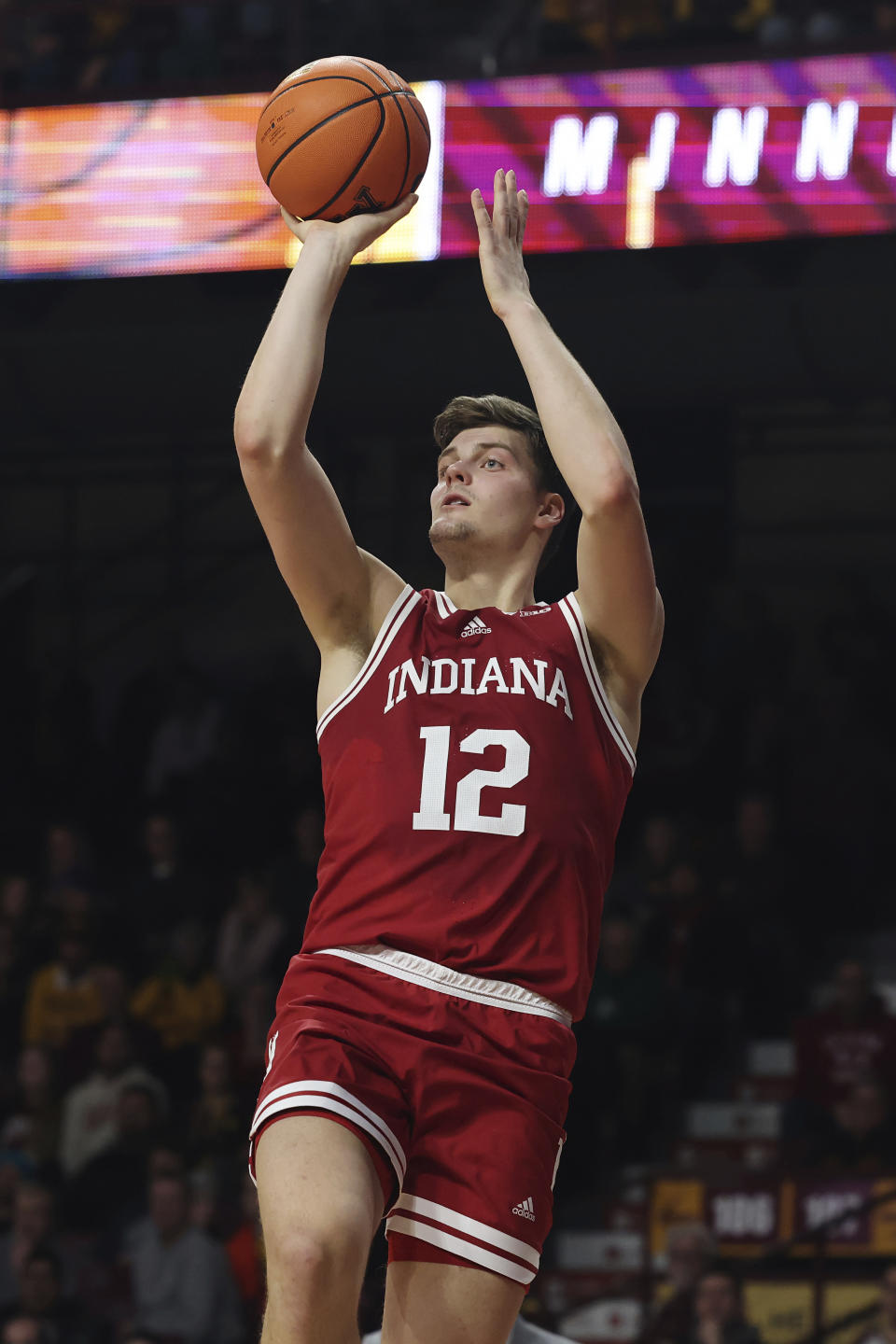 Indiana forward Miller Kopp (12) shoots during the second half of the team's NCAA college basketball game against Minnesota, Wednesday, Jan. 25, 2023, in Minneapolis. Indiana won 61-57. (AP Photo/Stacy Bengs)