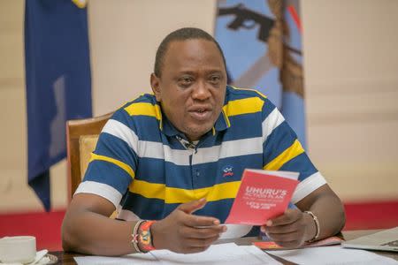 Kenya's President Uhuru Kenyatta answers questions from the public through Facebook Live at the State House in Nairobi, Kenya July 23, 2017. Presidential Press Service/Handout via REUTERS