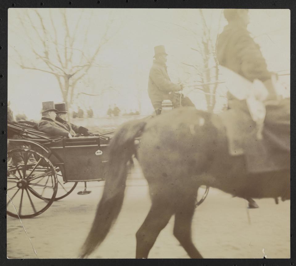 Benjamin Harrison and Grover Cleveland ride in a horse-drawn carriage at Cleveland's second inauguration on March 4, 1893.