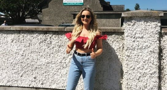 Dr Lauren McKeown in a red crop top and jeans