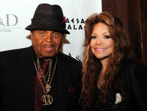 Joe Jackson and his daughter La Toya Jackson pose as they attend the launch of the new fragances, "Jackson Tribute" for men and "Jackson Legend" for women, in Las Vegas, Nevada, on June 9. The botched launch of the perfume in memory of pop icon Michael Jackson caused a stink this week, as Joe Jackson distanced himself from Rouas and a lawsuit disputed their rights