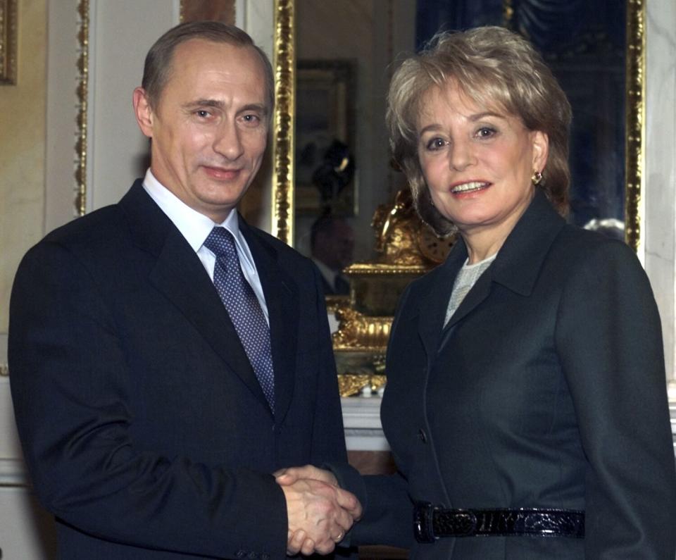 Russian President Vladimir Putin shakes hands with Barbara Walters