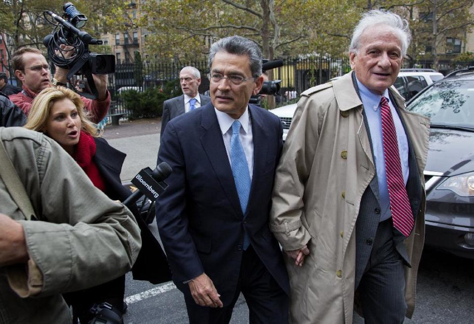 Former Goldman Sachs and Procter & Gamble Co. board member Rajat Gupta, center, arrives at court in New York Wednesday, Oct. 24, 2012. Gupta is to be sentenced after being found guilty insider trading by passing secrets between March 2007 and January 2009 to a billionaire hedge fund founder who used the information to make millions of dollars. At right is Gupta's attorney Gary Naftalis. (AP Photo/Craig Ruttle)