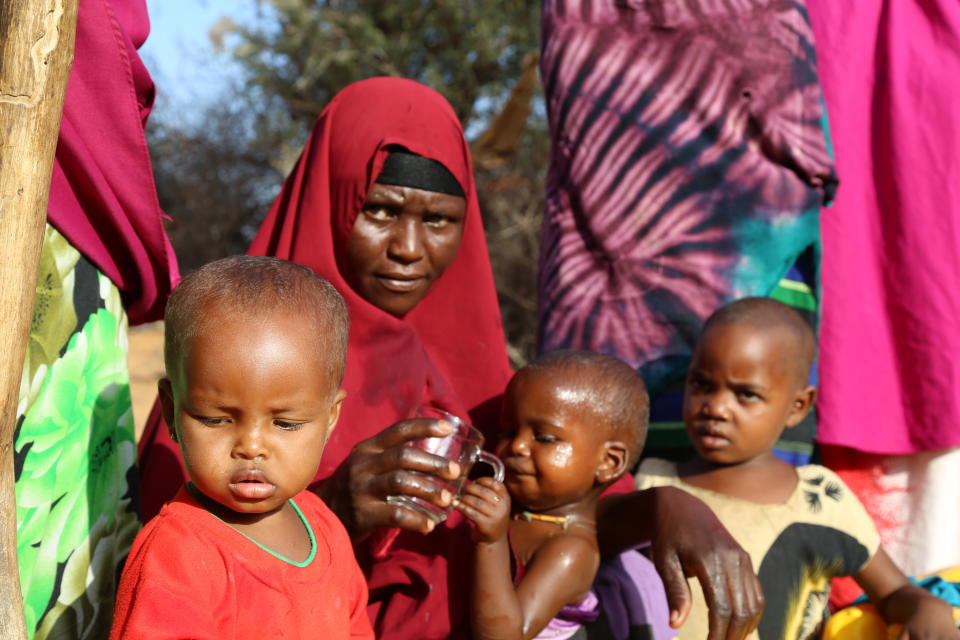 Mano Hassan waits for water with her son at a camp on the outskirts of Mogadishu, Somalia's capital.