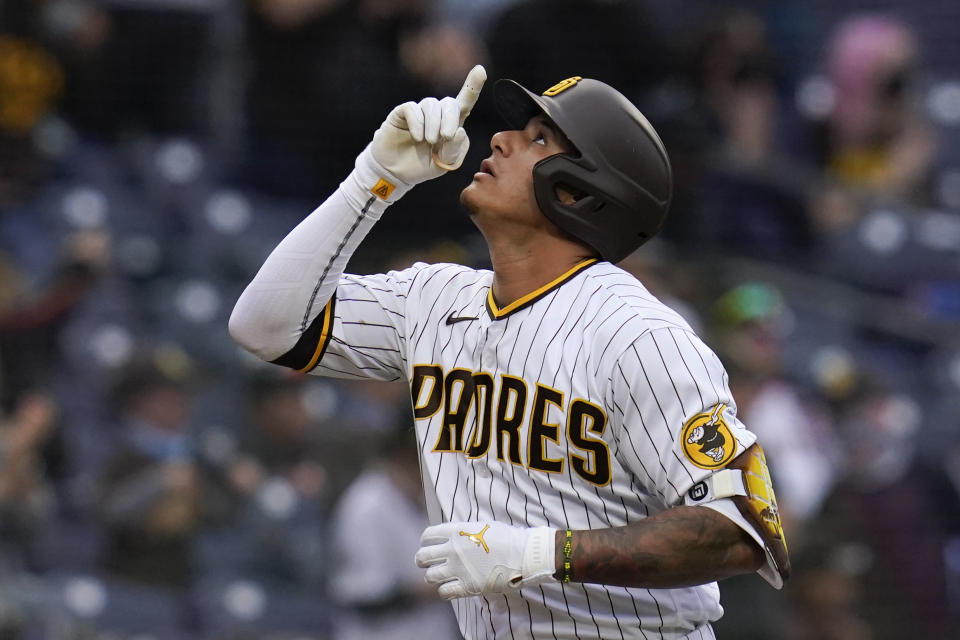 San Diego Padres' Manny Machado reacts after hitting a three-run home run during the first inning of a baseball game against the San Francisco Giants, Saturday, May 1, 2021, in San Diego. (AP Photo/Gregory Bull)