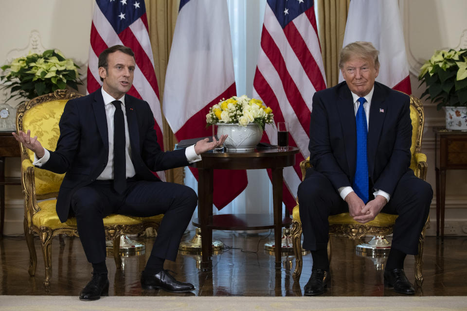 President Donald Trump listens as French President Emmanuel Macron speaks during a meeting at Winfield House during the NATO summit, Tuesday, Dec. 3, 2019, in London. (AP Photo/ Evan Vucci)