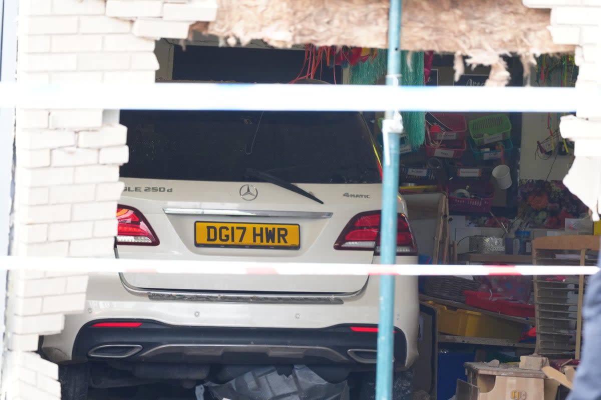 The Mercedes appeared to have gone through the wall of the school in Liverpool and could be seen inside a classroom (Peter Byrne/PA Wire)