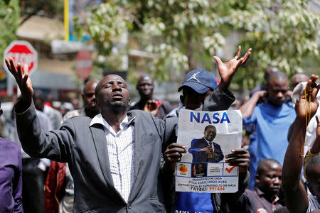 National Super Alliance (NASA) coalition supporters pray near Kenya's Supreme Court in Nairobi, Kenya September 20, 2017. REUTERS/Thomas Mukoya