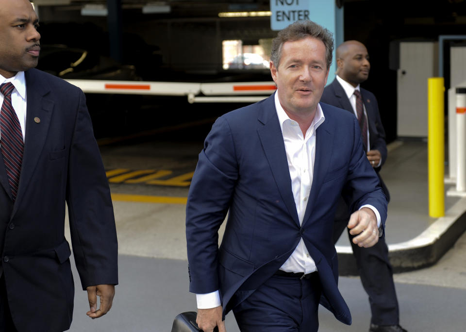 British talk show host Piers Morgan and former News of the World editor arrives for work at CNN after his British judicial inquiry in Los Angeles, California December 20, 2011. Morgan told a British judicial inquiry on Tuesday that he had never approved phone hacking during his time as a tabloid newspaper editor, and that his published boasts had merely been repeating rumours about journalistic ``dark arts.'' REUTERS/Gus Ruelas (UNITED STATES - Tags: CRIME LAW ENTERTAINMENT MEDIA)