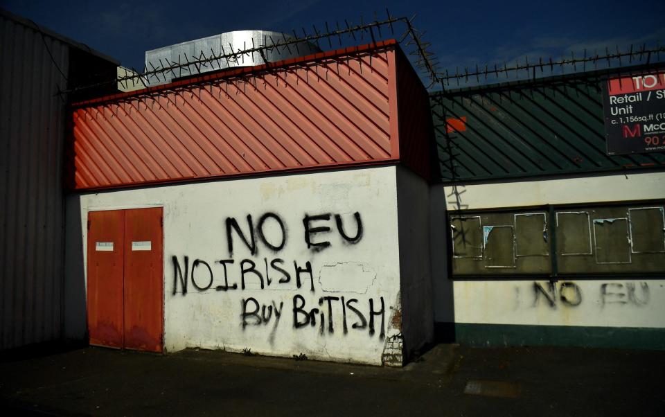 Graffiti against the Northern Irish Protocol in Belfast - Clodagh Kilcoyne/Reuters