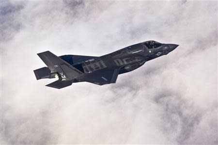 A Lockheed Martin F-35B Lightning II joint strike fighter flies toward its new home at Eglin Air Force Base, Florida in this U.S. Air Force picture taken on January 11, 2011. REUTERS/U.S. Air Force