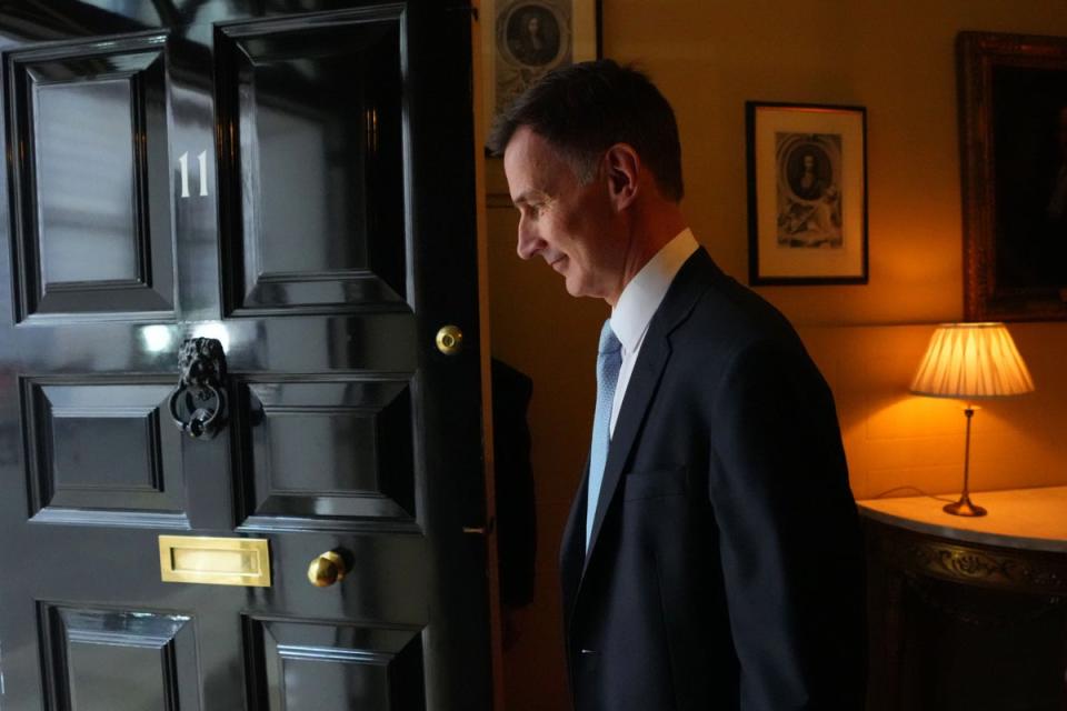 Chancellor of the Exchequer Jeremy Hunt exits 11 Downing Street ahead of delivering his Budget (PA Wire)