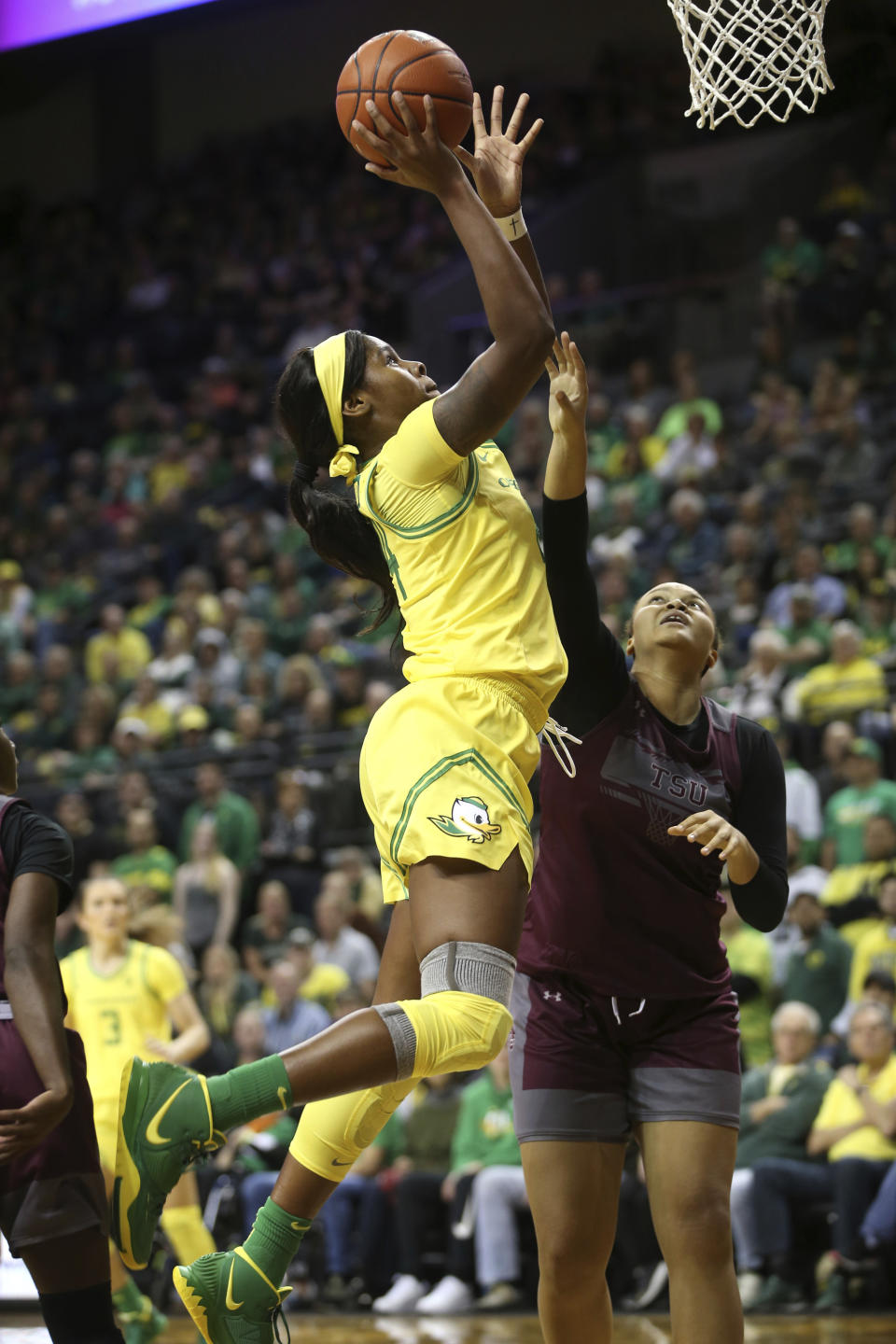 Oregon's Ruthy Hebard, left, shots over Texas Southern's Lauren Lewis during second quarter of an NCAA college basketball game in Eugene, Ore., Saturday, Nov. 16, 2019. (AP Photo/Chris Pietsch)