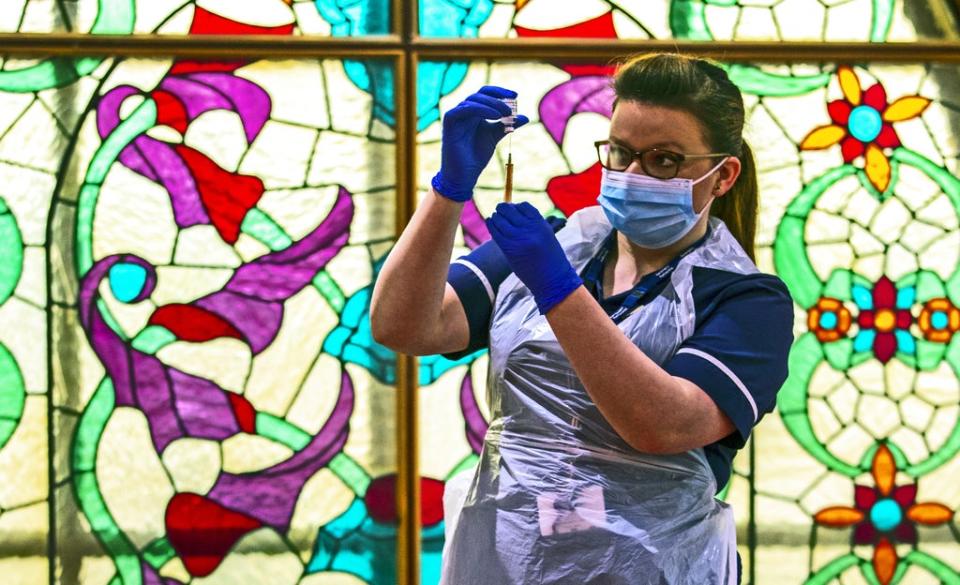Practice nurse Hannah Currie, 25, prepares a dose of the AstraZeneca vaccine at Bradford Central Mosque (Peter Byrne/PA) (PA Archive)