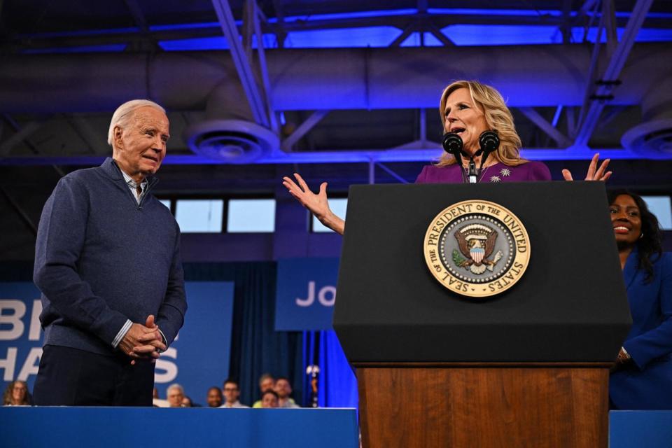 PHOTO: President Joe Biden listens as First Lady Jill Biden speaks during a campaign event in Philadelphia, on March 8, 2024. (Jim Watson/AFP via Getty Images)