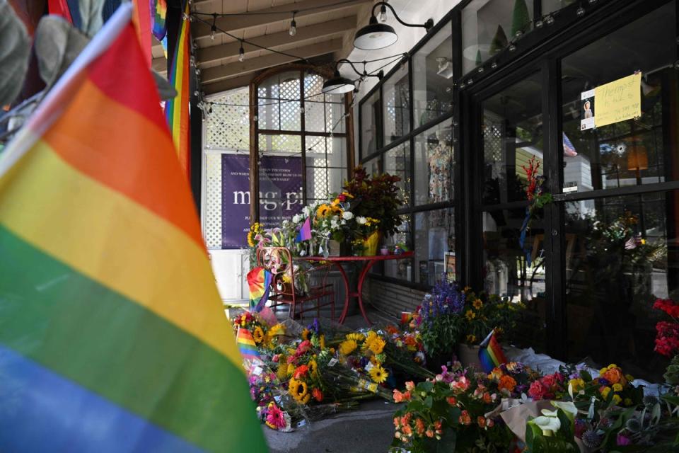 A makeshift memorial is seen outside the Mag Pi clothing store (AFP via Getty Images)