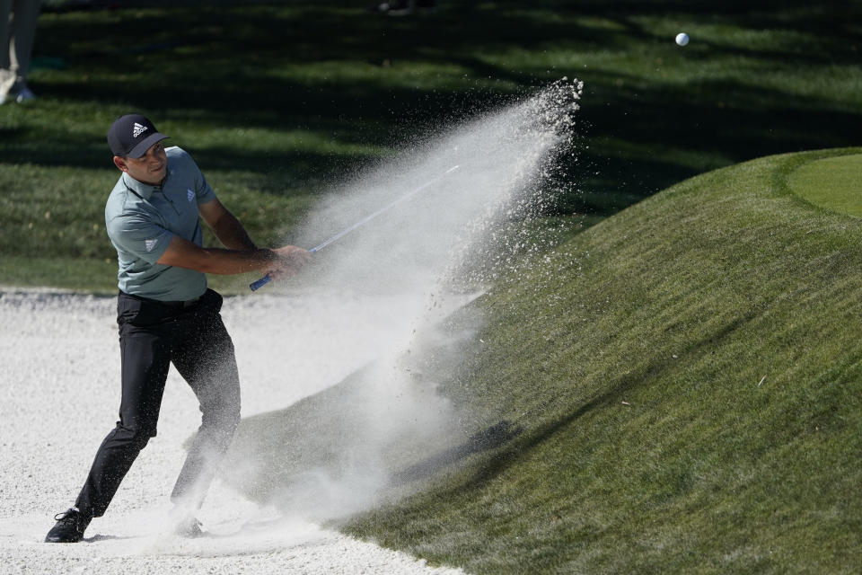 Sergio Garcia, of Spain, hits from the bunker on the ninth hole during the second round of the The Players Championship golf tournament Friday, March 12, 2021, in Ponte Vedra Beach, Fla. (AP Photo/John Raoux)