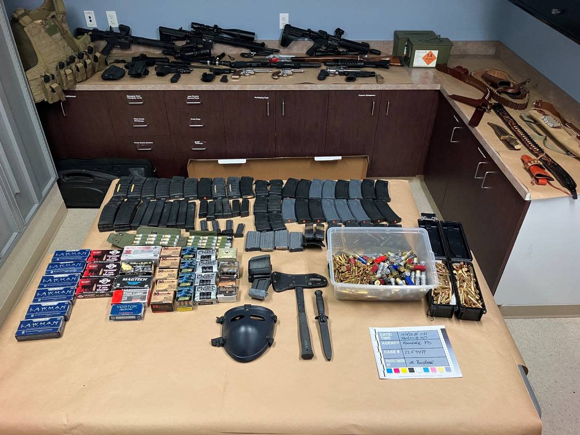 Police confiscated 11 firearms along along with ammunition, knives, a hatchet and body armor following a nearly six-hour standoff with a man at a motel Tuesday, Oct. 4, in Ferndale.