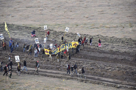 Protester gather near a pipeline being built by a group of companies led by Energy Transfer Partners LP at a construction site in North Dakota before being confronted by police October 22, 2016. Photo courtesy Morton County Sheriff's Office/Handout via REUTERS