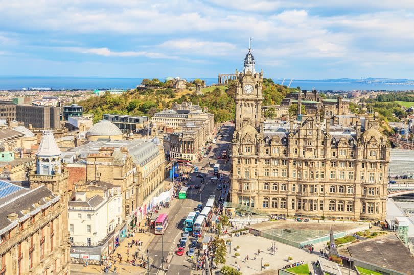 Photograph of Edinburgh from the Scott Monument overlooking east on Princes Street photographed in the sunshine in September 2014