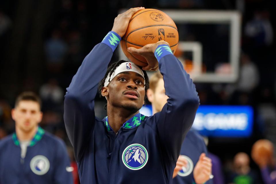 Mar 23, 2022; Minneapolis, Minnesota, USA; Minnesota Timberwolves forward Jarred Vanderbilt (8) shoots during warmups before the game against the Phoenix Suns at Target Center.