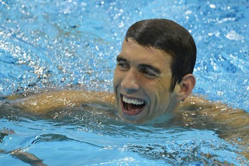 US swimmer Michael Phelps celebrates after winning the men's 4x200m freestyle relay final during the swimming event at the London 2012 Olympic Games in London. Phelps became the most decorated Olympian of all time on Tuesday, winning a record 19th medal in the pool as China's swimming sensation Ye Shiwen grabbed her second gold of the Games