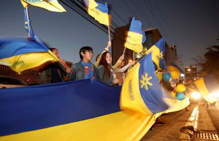 FILE PHOTO: Supporters of Fabricio Alvarado, presidential candidate of the National Restoration party (PRN), cheer before the debate for the Costa Rica 2018 presidential election in San Jose, Costa Rica, January 30, 2018. REUTERS/Juan Carlos Ulate