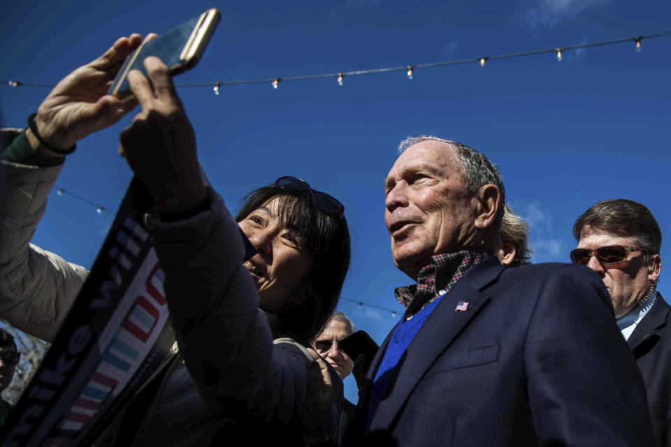 A supporter tries to take a selfie with Democratic presidential candidate Michael Bloomberg after his speech during his presidential campaign in Austin, Texas, Saturday, Jan. 11, 2020. (Lola Gomez/Austin American-Statesman via AP)