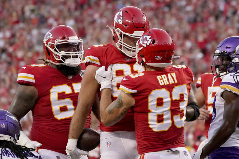 Kansas City Chiefs tight end Blake Bell (81) is congratulated by Noah Gray (83) and Lucas Niang (67) after scoring during the first half of an NFL football game against the Minnesota Vikings Friday, Aug. 27, 2021, in Kansas City, Mo. (AP Photo/Charlie Riedel)