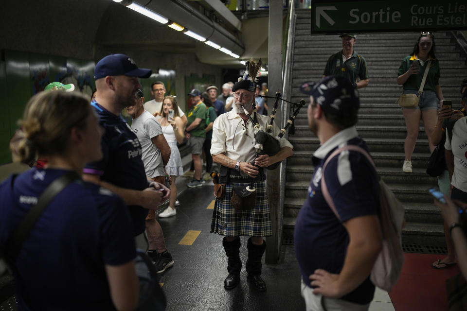 A Scottish fan plays the bagpipes as he waits for the subway to go to the Rugby World Cup Pool B match between South Africa and Scotland at the Stade Velodrome in Marseille, Sunday, Sept. 10, 2023. (AP Photo/Daniel Cole)