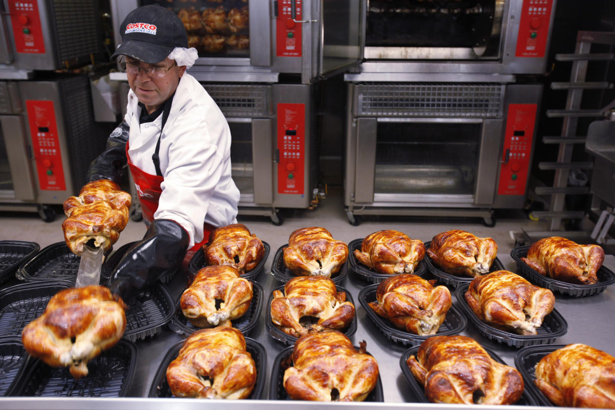 A Costco employee cooks chicken at Costco in Mountain View, Calif., Wednesday, March 3, 2010. Many retailers are reporting solid sales gains for February, even in the face of falling consumer confidence and heavy snowstorms that hammered the East Coast. (AP Photo/Paul Sakuma)