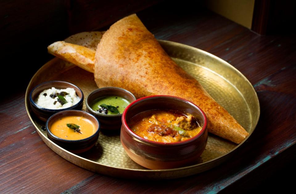 Good game: Dosa and guinea fowl kari, coriander chutney, tomato chutney, coconut chutney (John Carey)