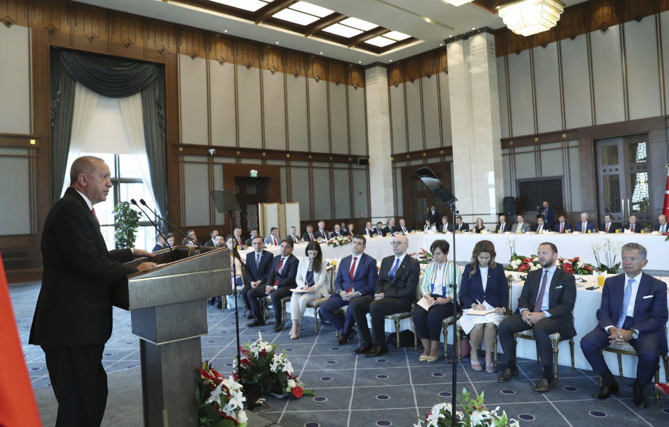 Turkey's President Recep Tayyip Erdogan speaks to a group of US businessmen at his palace, in Ankara, Turkey, Tuesday, Sept. 10, 2019. Turkey accused the United States on Tuesday of taking only "cosmetic steps" toward the creation of a so-called "safe zone" in northeast Syria and renewed Ankara's threat of unilateral military intervention to form a buffer area along its border.(Presidential Press Service via AP, Pool)