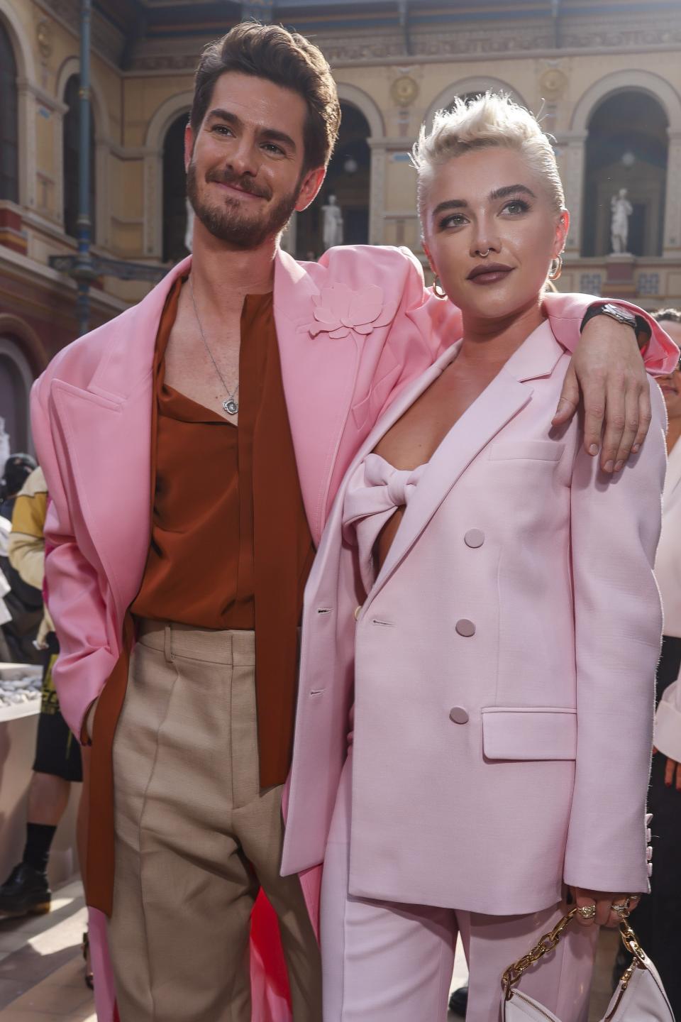 Andrew Garfield, left, and Florence Pugh attend the Valentino Spring/Summer 2024 womenswear fashion collection presented Sunday, Oct. 1, 2023 in Paris. (AP Photo/Vianney Le Caer)