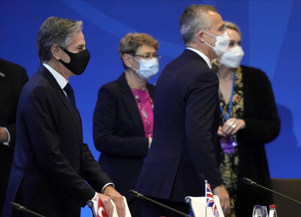 U.S. Secretary of State Antony Blinken, left, and NATO Secretary General Jens Stoltenberg attend the NATO Foreign Ministers meeting in Riga, Latvia, Wednesday, Dec. 1, 2021. (AP Photo/Roman Koksarov)