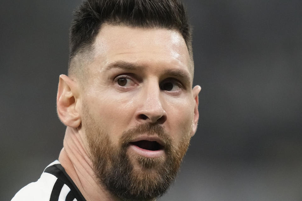 Argentina's Lionel Messi watches his team mates during the World Cup final soccer match between Argentina and France at the Lusail Stadium in Lusail, Qatar, Sunday, Dec. 18, 2022. (AP Photo/Frank Augstein)