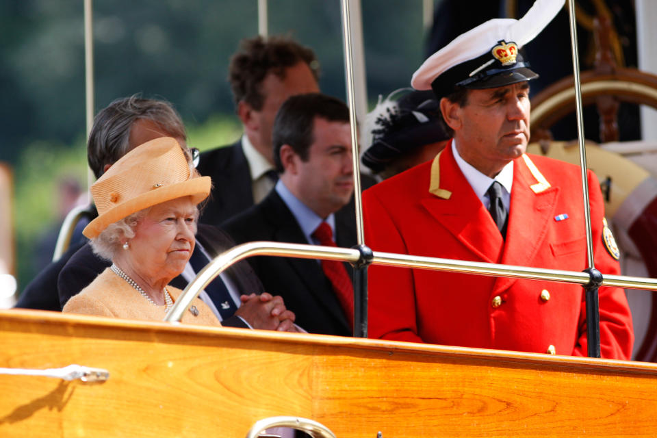 WINDSOR, UNITED KINGDOM - JULY 20:  Queen Elizabeth II, accompanied by Swan Marker David Barker, watches the swan upping census from the steam launch 'Alaska' on the River Thames on July 20, 2009 near Windsor, England. During the ancient annual ceremony the Swan Marker leads a team of Swan Uppers on a five-day journey along the River Thames from Sunbury-on-Thames through Windsor to Abingdon counting, marking and checking the health of all unmarked swans.  (Photo by Sang Tan - WPA Pool/Getty Images)