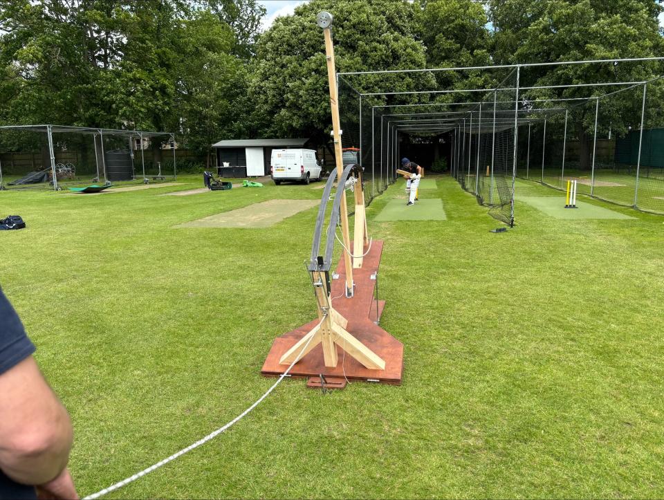 A batter strikes a ball launched by the Venn bowling machine. (Sam Russell/ PA)