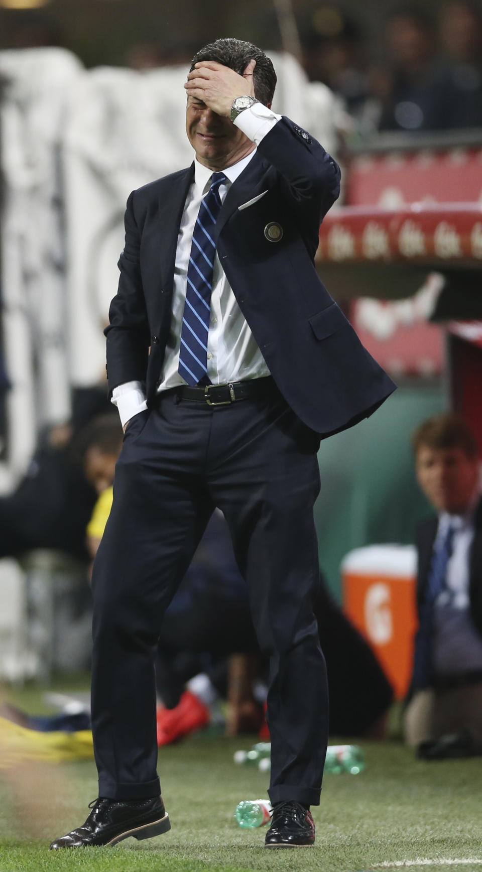 Inter Milan coach Walter Mazzarri touches his head reacting during a Serie A soccer match between Inter Milan and Napoli, at the San Siro stadium in Milan, Italy, Saturday, April 26, 2014. (AP Photo/Luca Bruno)