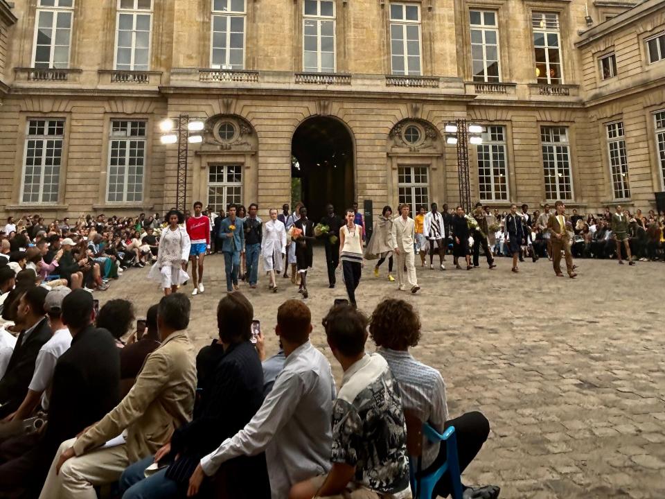 people watching a fashion show as part of paris fashion week 2023