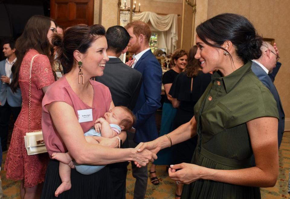 Meghan Markle meeting a new mom in Sydney on Oct. 16.