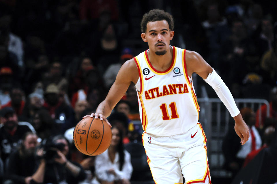 Atlanta Hawks guard Trae Young brings the ball up against the Orlando Magic during the first half of an NBA basketball game Friday, Oct. 21, 2022, in Atlanta. (AP Photo/Butch Dill)