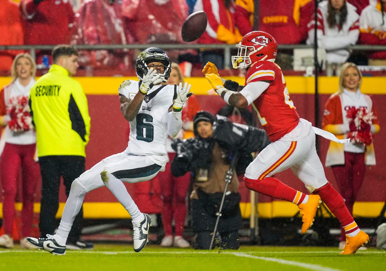 Philadelphia Eagles wide receiver DeVonta Smith (6) catches a pass while defended by Kansas City Chiefs safety Mike Edwards.