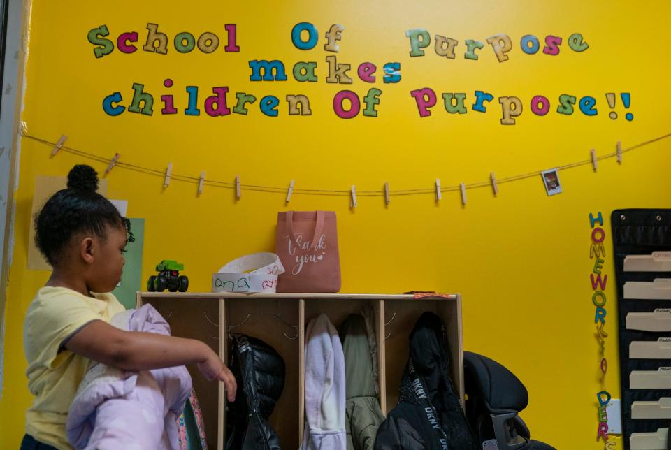 Cyriah Dukes, 4, arrives at the School of Purpose in Detroit on Wednesday, March 20, 2024. CEO of the school, Tissua Franklin is hoping to change the literacy preparation for children in Detroit. Franklin not only published a handbook to help educators and parents help their children but she has created a day care center that is focused on teaching children how to identify letters and numbers and words and to get a jump-start on reading before kindergarten.