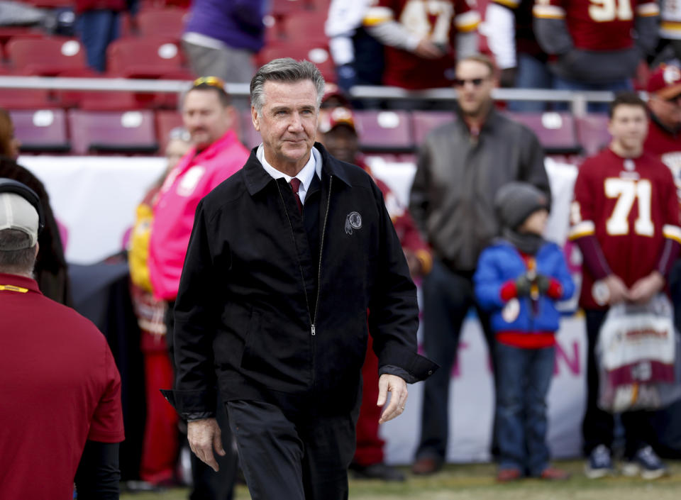 FILE - In this Oct. 21, 2018 file photo, Washington Redskins President Bruce Allen walks across the field before an NFL football game against the Dallas Cowboys in Landover, Md. Allen was fired Monday, Dec. 30, 2019, after a tumultuous and loss-filled decade with the NFL team once coached by his father. (AP Photo/Andrew Harnik, File)