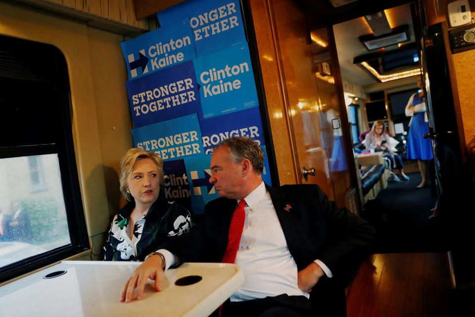 Hillary Clinton speaks with vice presidential nominee Tim Kaine