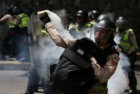 National guard throws a tear gas canister during a rally against Venezuela's President Nicolas Maduro's government in Caracas, Venezuela April 1, 2017 REUTERS/Carlos Garcia Rawlins