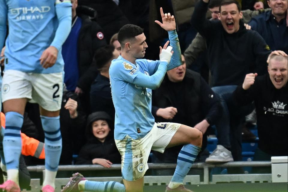 Phil Foden scored two superb goals as Man City came from behind to beat Man Utd 3-1  (AFP via Getty Images)