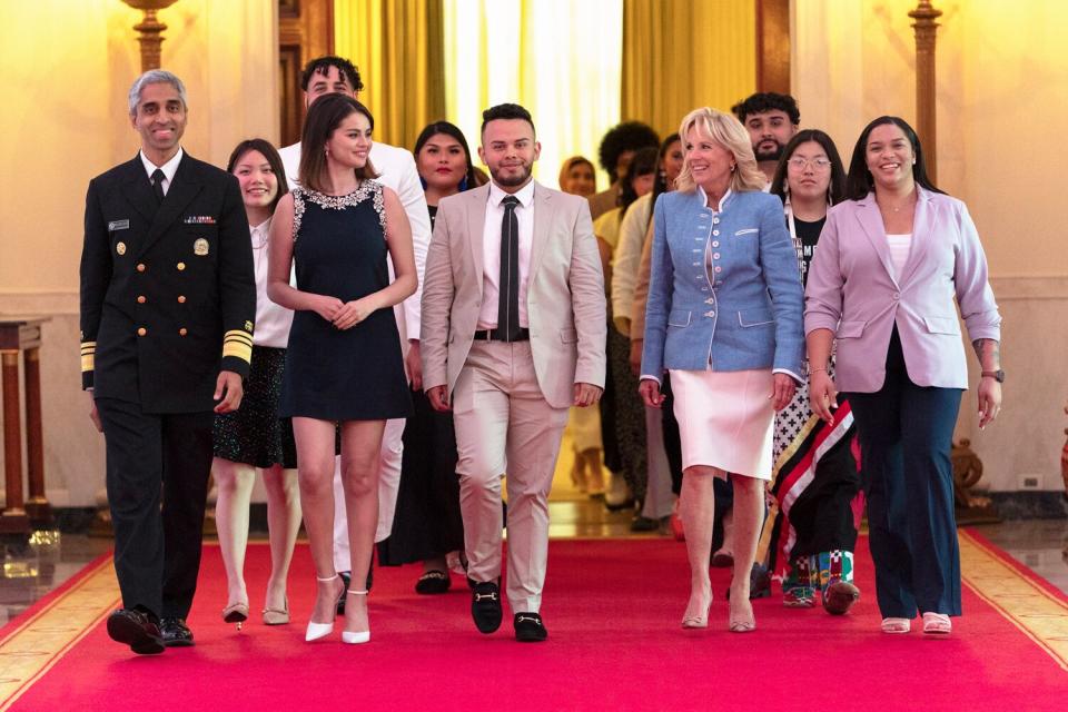 First lady Jill Biden arrives to the White House Conversation on Youth Mental Health, with from left, Surgeon General Dr. Vivek Murthy, mental health advocate and actress Selena Gomez, Juan Acosta, the first lady, Jazmine Wildcat, and Ayanna Kelly, Wednesday, May 18, 2022, at the White House in Washington.